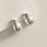 Sleek and bold sterling silver dome hoops