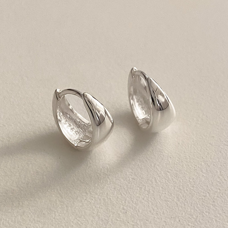 Thick modern hoop earrings in teardrop design