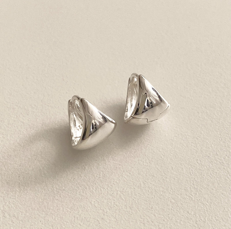 Modern triangle dome earrings in sterling silver with a chunky, geometric design that merges boldness with elegance, perfect for those who appreciate subtle architectural jewellery.


