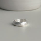 Chunky matte sterling silver band ring with a curved dome shape, perfect for modern fashion styling or worn solo as a statement accessory.