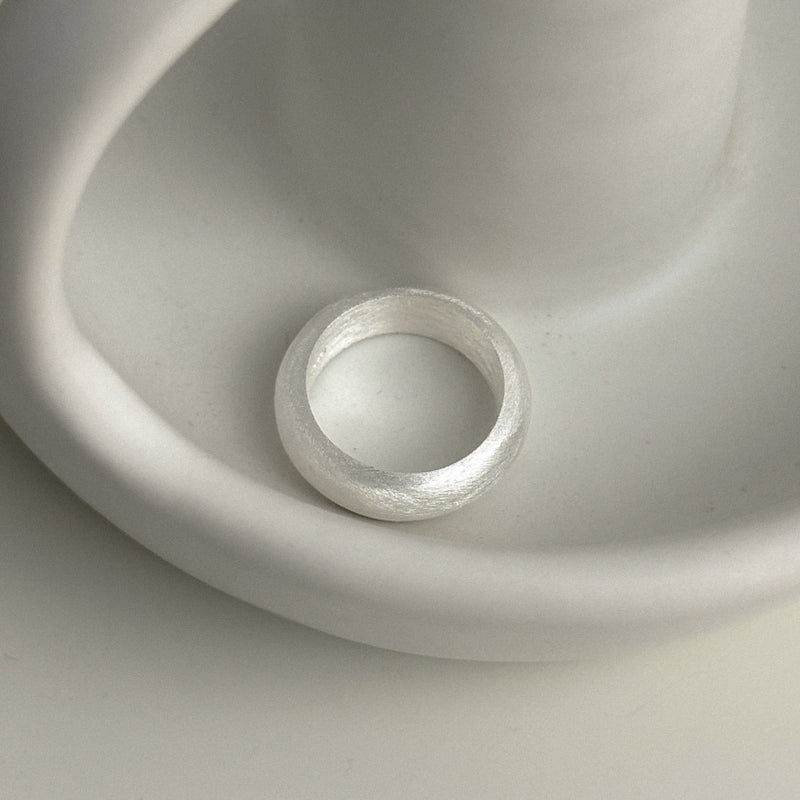 Minimalist sterling silver ring with a chunky dome silhouette and brushed matte texture, perfect for daily wear or stacking in modern layered looks.