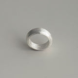 Unisex sterling silver dome ring featuring a bold profile and smooth matte surface, combining minimalism with architectural presence.