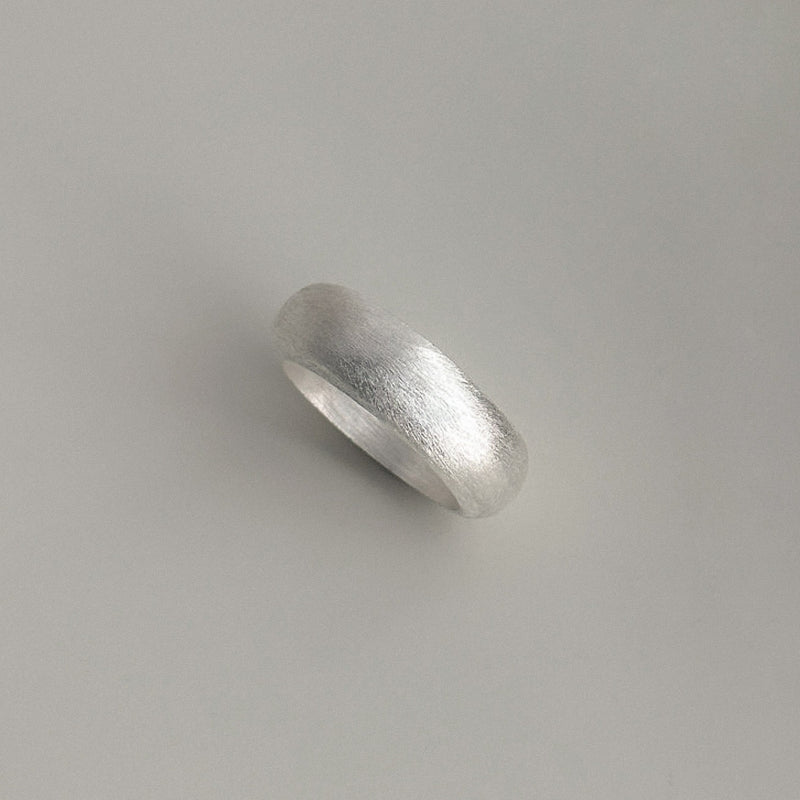 Classic bold matte silver ring with a soft brushed surface and domed body, ideal for lovers of clean design and quiet, refined luxury.