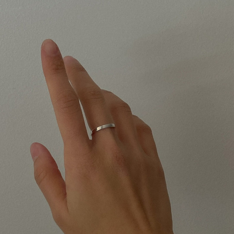 Classic flat band ring crafted from sterling silver, measuring 1.5mm in width. Sleek and simple with a mirror-like surface.