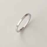 Thin silver band with a flat profile and smooth polish, made in sterling silver. A staple piece for minimalist styling or ring stacking.