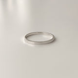Polished sterling silver ring with a 1.5mm flat design. Ideal for stacking, layering, or wearing as a subtle everyday band.