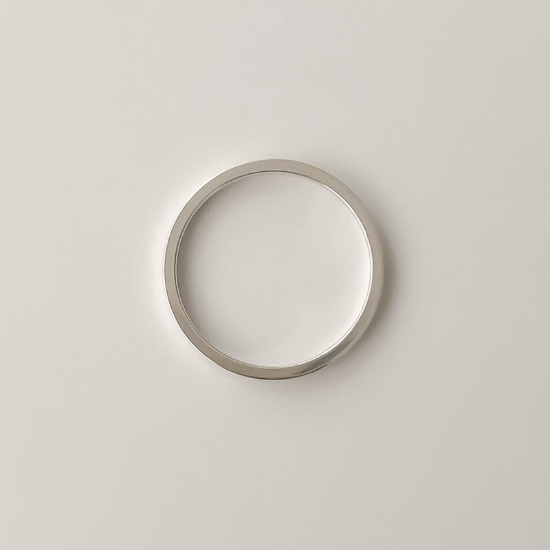 Timeless silver ring with a flat 1.5mm profile, handcrafted from sterling silver. Perfectly understated for any look.

