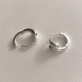 Refined and bold sterling silver hoops with a twin dome structure inspired by the teardrop shape. These earrings combine smooth organic curves with polished surfaces to create an elevated look.