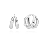Mini double line huggie hoop earrings crafted in sterling silver, featuring two smooth parallel curves that add dimension and a subtle sculptural element to the classic huggie design, perfect for everyday wear.