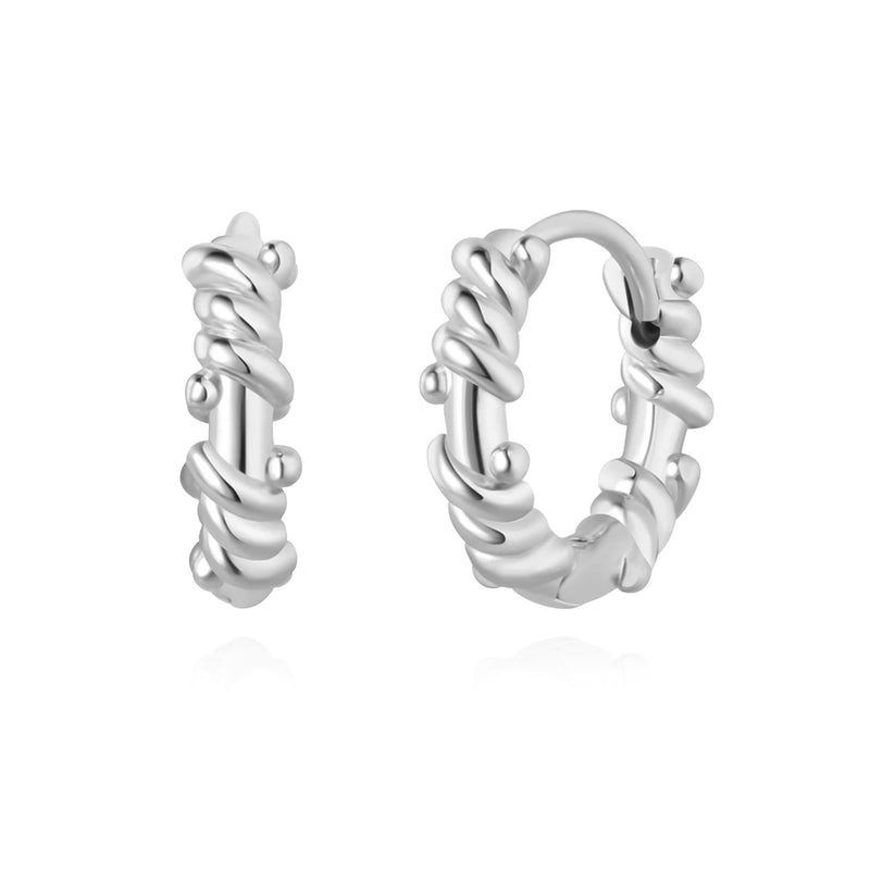 Sculpted rope huggie earrings made of sterling silver with twisted rope-inspired texture, polished shine, and minimalist yet bold everyday style.